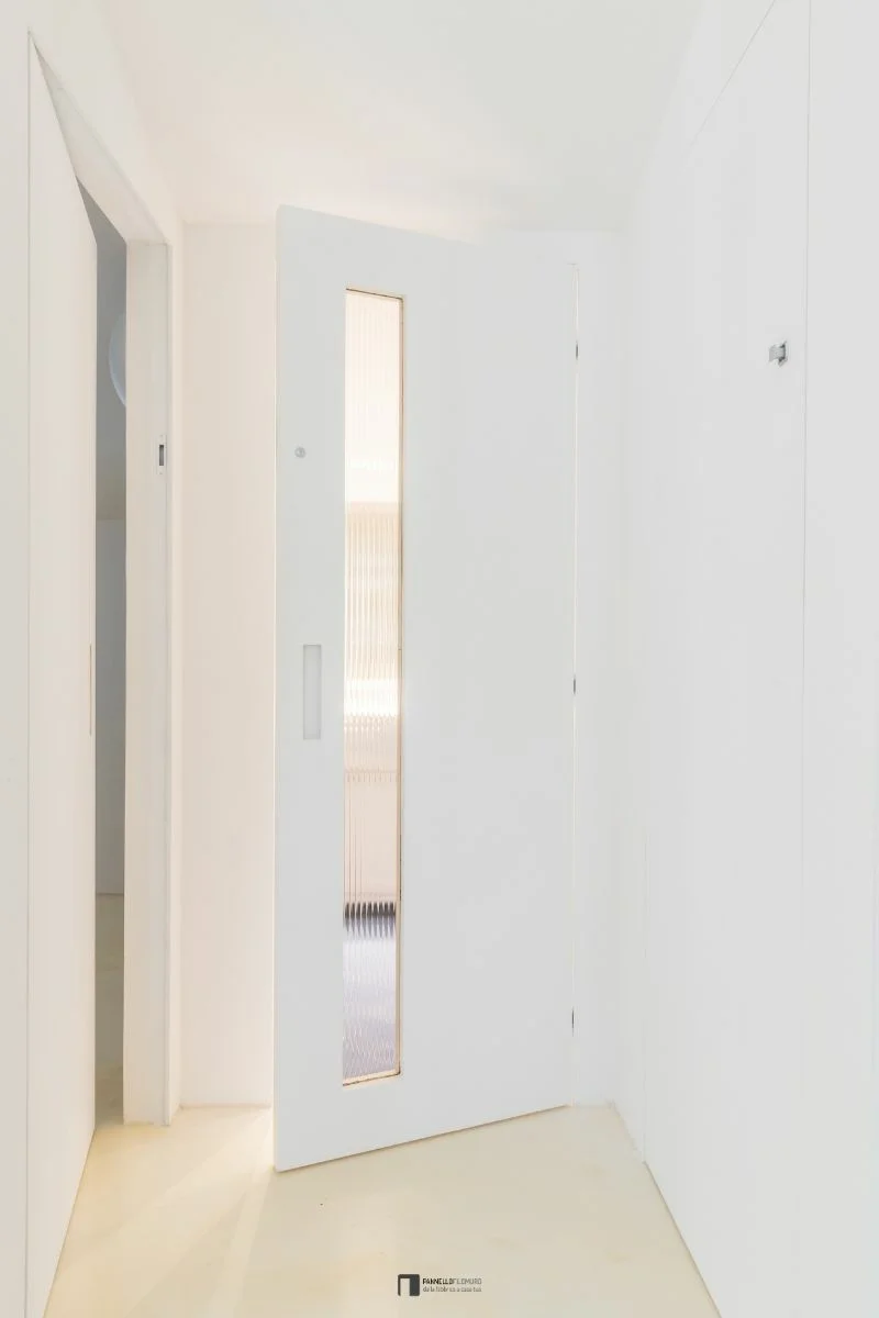 Invisible hinged door with open glass insert